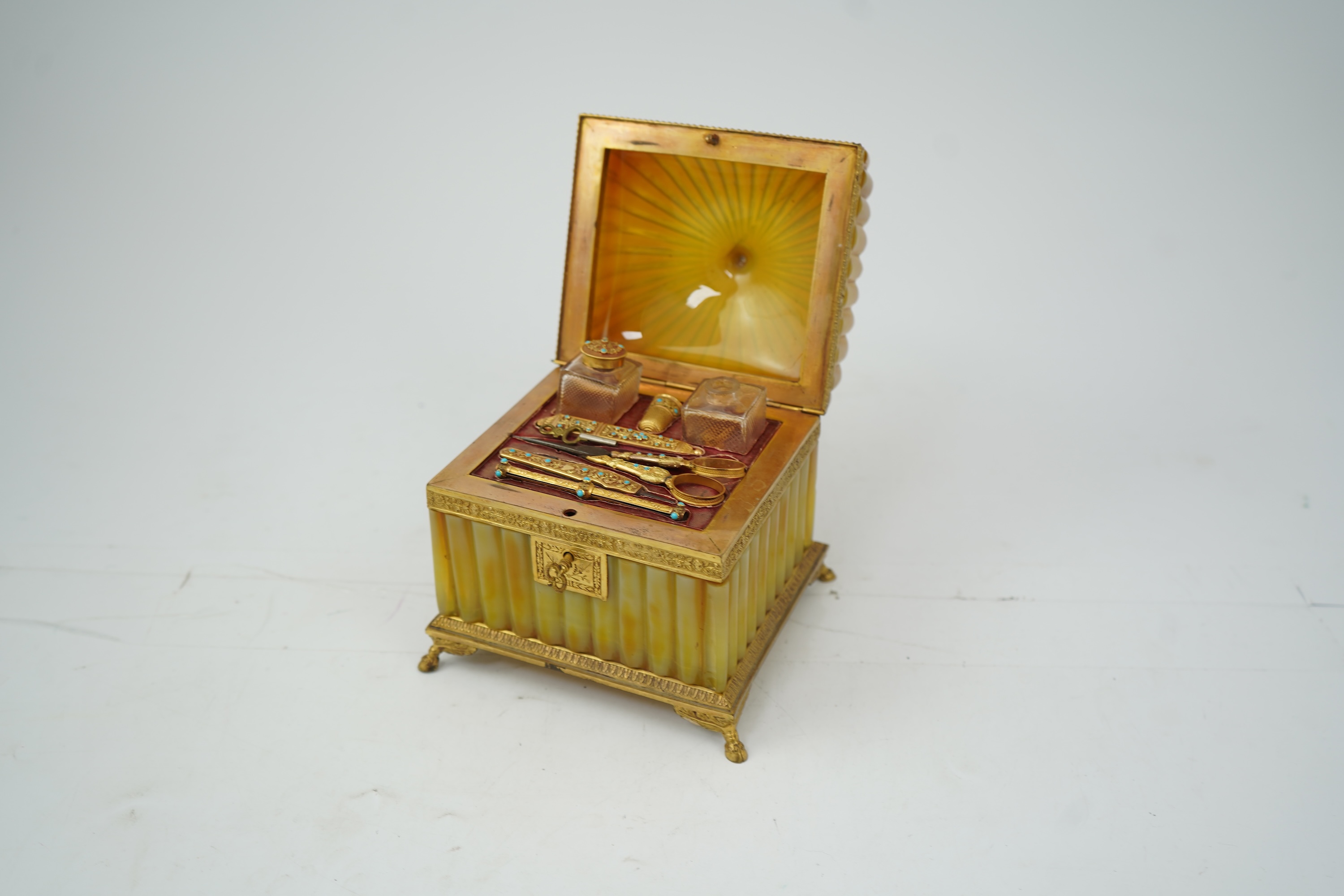 A mid 19th century French opaline glass necessaire box with turquoise and gold mounted accessories